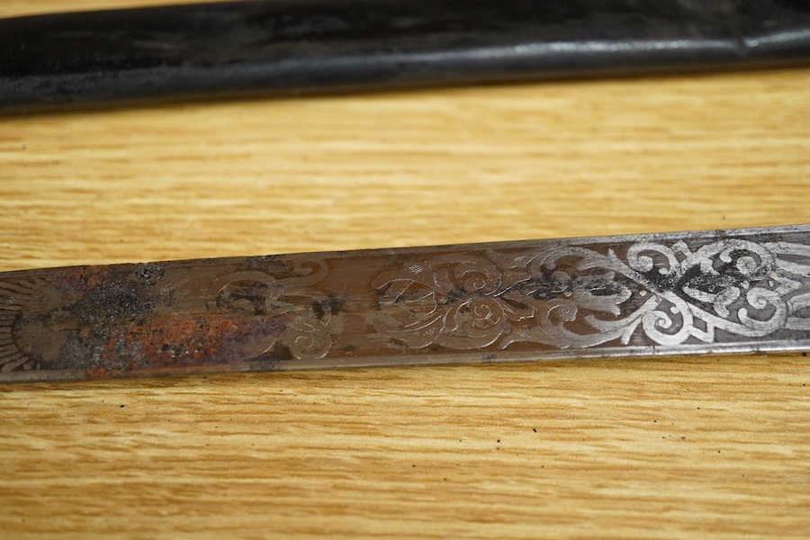 A post 1901 British naval officer’s dirk, the locket engraved with owners initials ‘CHCO’R’, regulation gilt brass mounts, with wire bound fish skin grip, bullion dress knot, in its original scabbard, blade etched with c